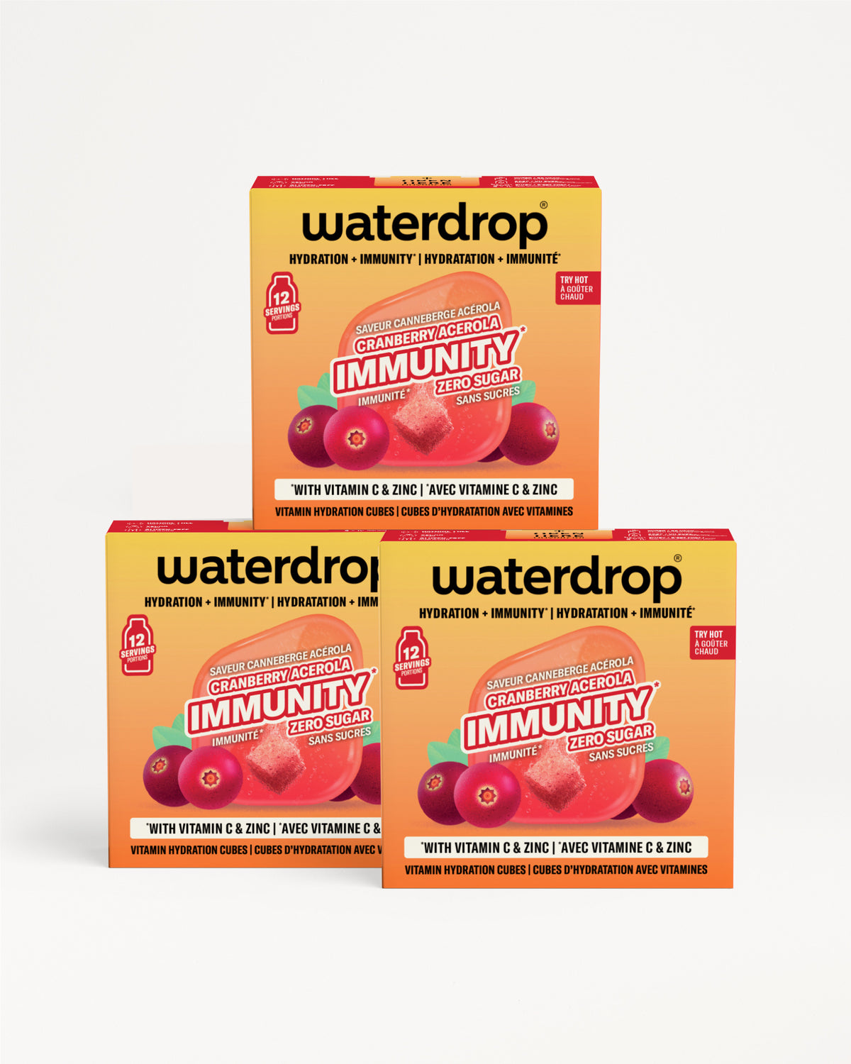 Tres cajas naranjo-amarillo de Waterdrop de inmunidad apiladas, con gráficos de bayas.