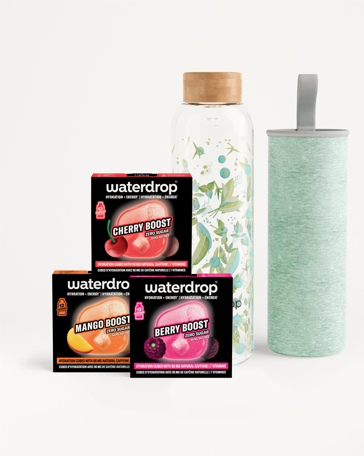 Conjunto de tres cajas Waterdrop flavor boost junto a una botella de vidrio con tapa de madera y un vaso verde claro.