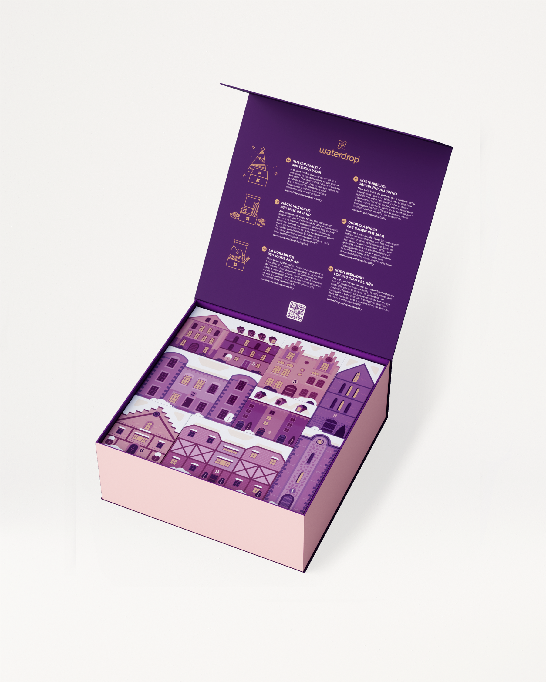 Advent Calendar Large: Purple box featuring buildings, filled with limited edition accessories, drinkware, and bestselling flavours. Doubles as festive keepsake storage.