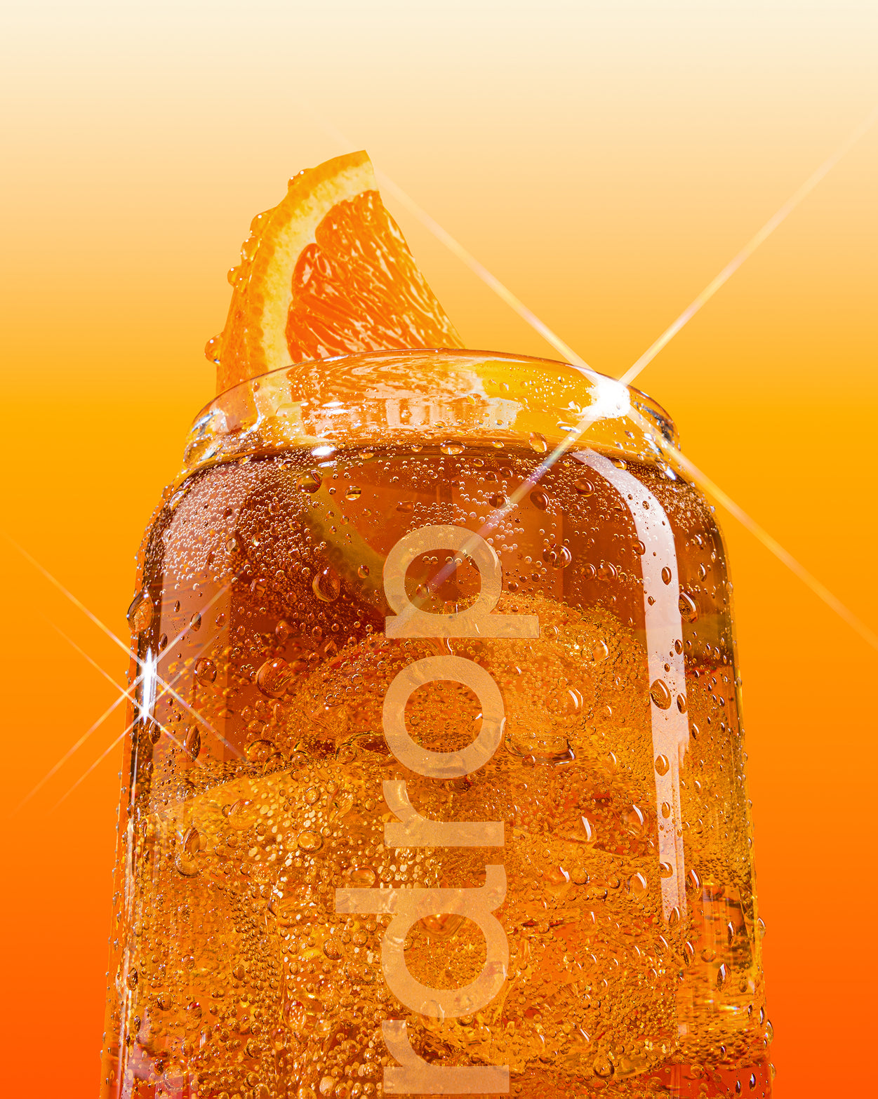 COLA Glass Can Set with orange soda and ice cubes.