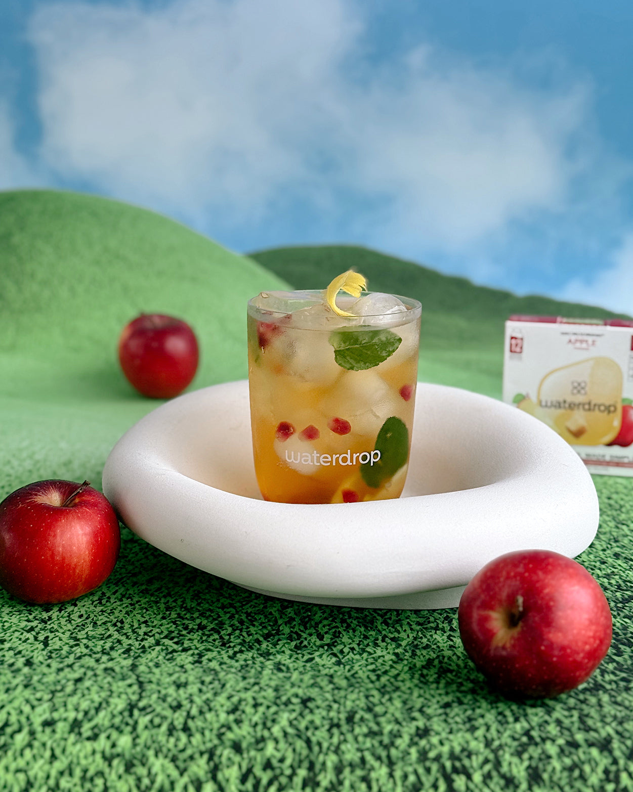 Apple Sparkle Set with tumbler, fruit, and Waterdrop cubes.
