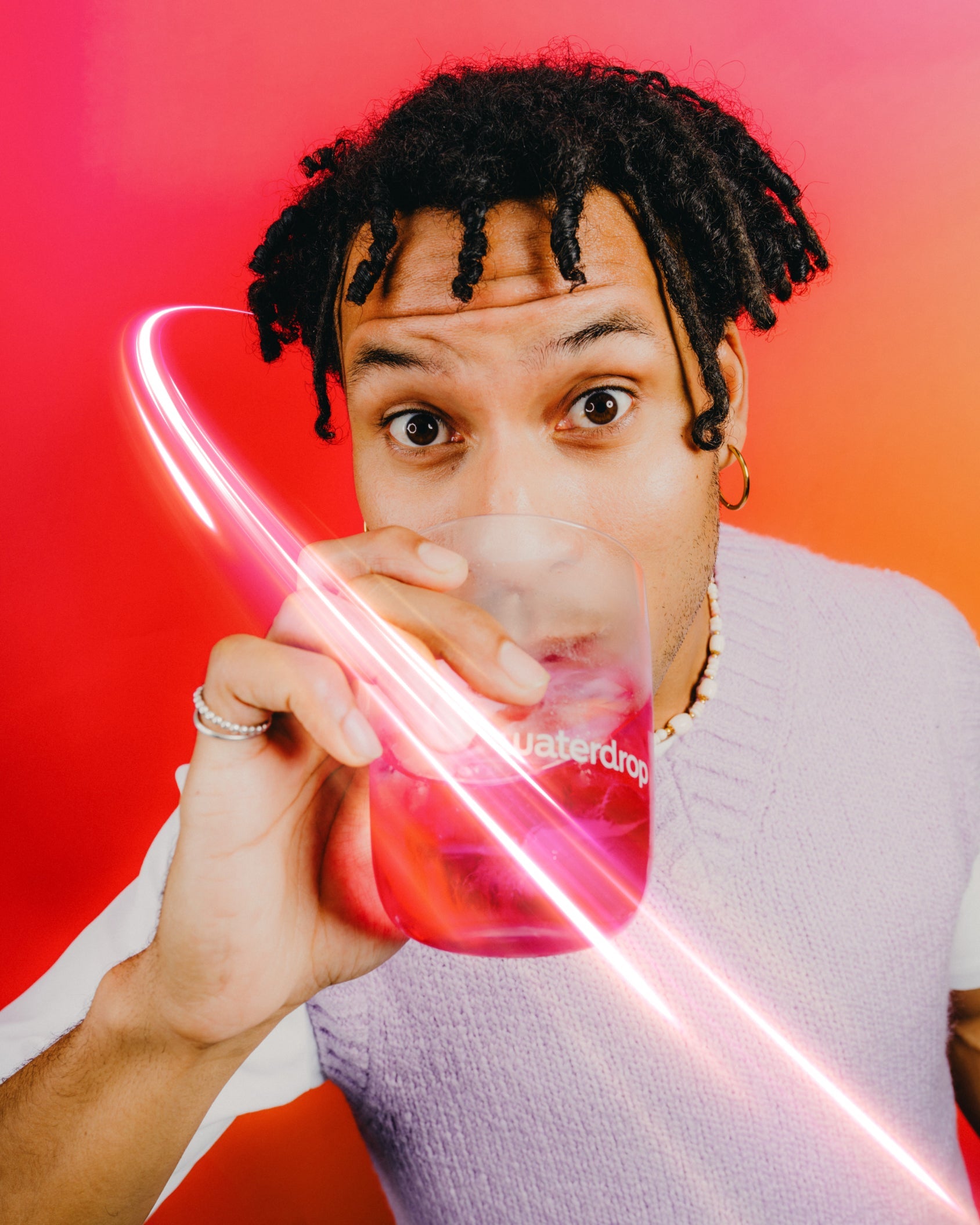 Young person sipping Microenergy BOOST Twin Pack drink.