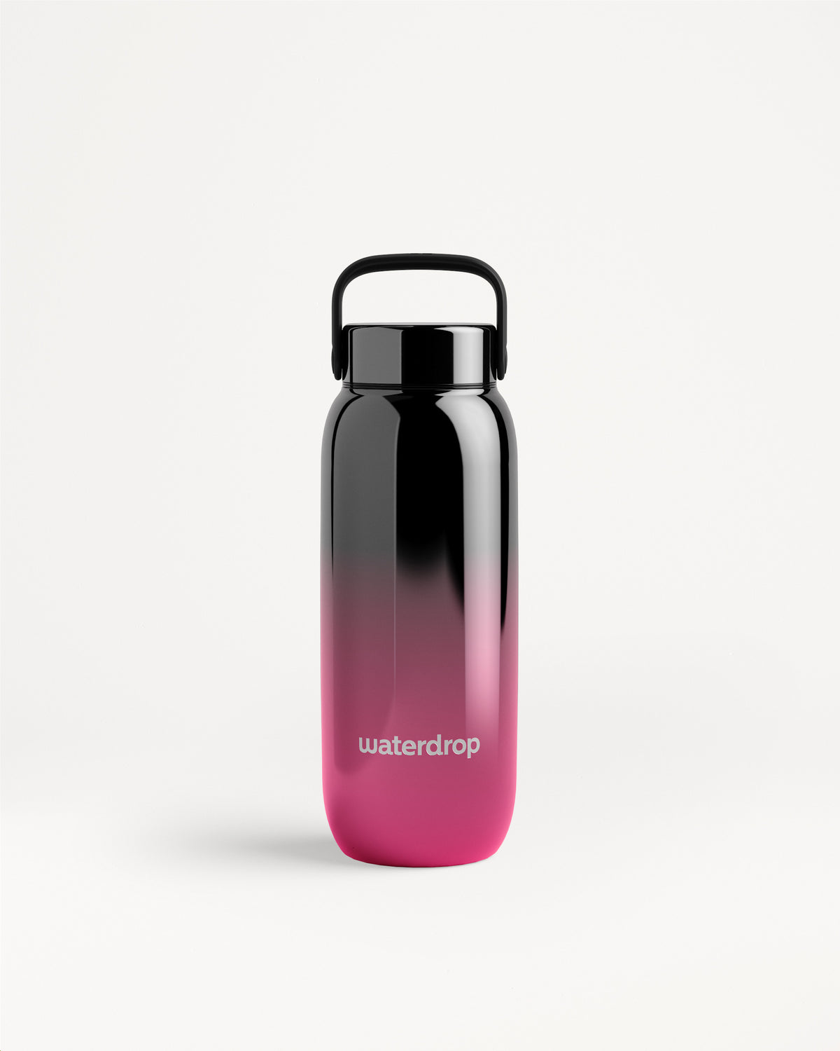 Botella de agua con degradado de negro a rosa, tapa negra y asa.
