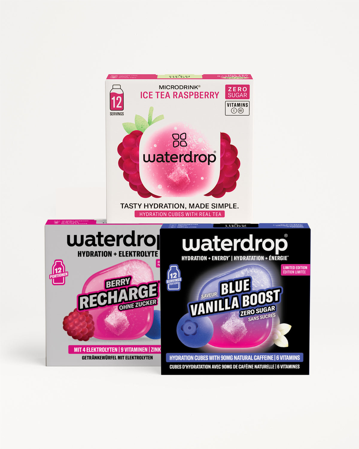 Tres cajas Waterdrop para hidratación apiladas en pirámide, con diseños de empaque rosa, morado y azul.