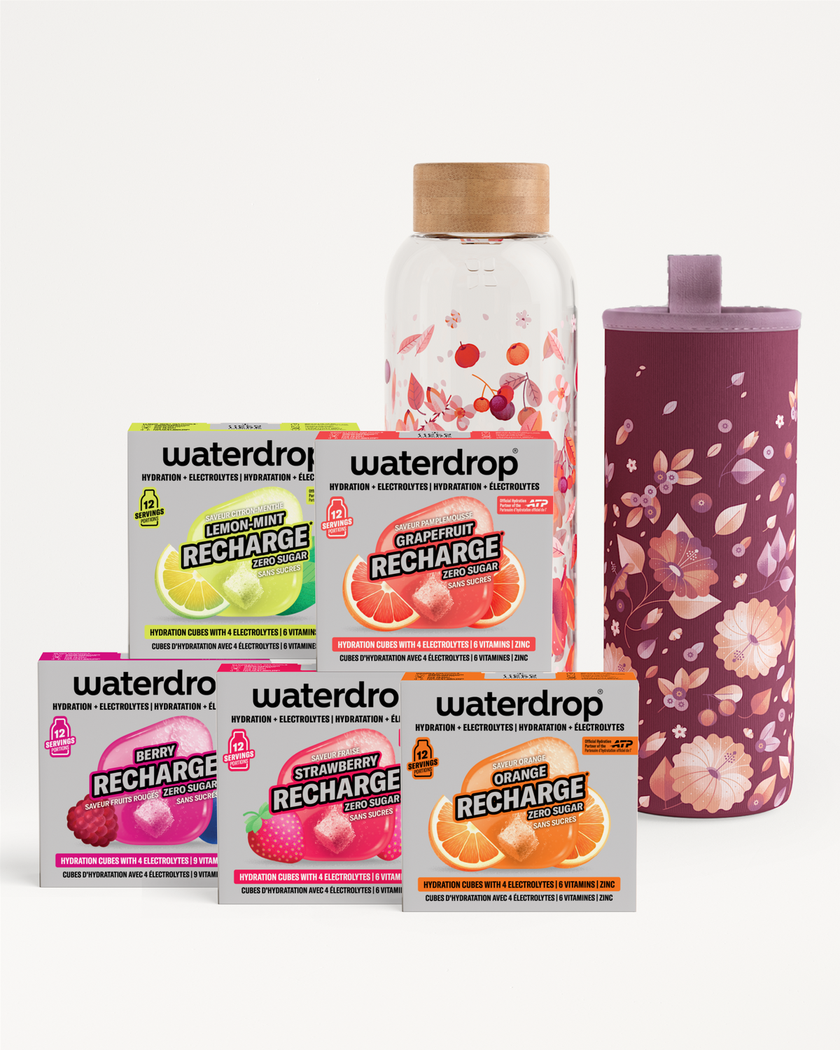 Paquetes variados de recarga de sabores junto a una botella transparente y un vaso morado con diseño floral.