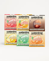 Seis cajas de mezclas de bebidas Waterdrop dispuestas en dos filas de tres.