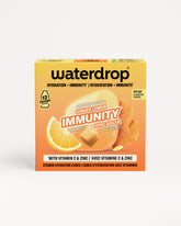 Caja naranja de Waterdrop para la inmunidad con imagen de limón y jengibre.