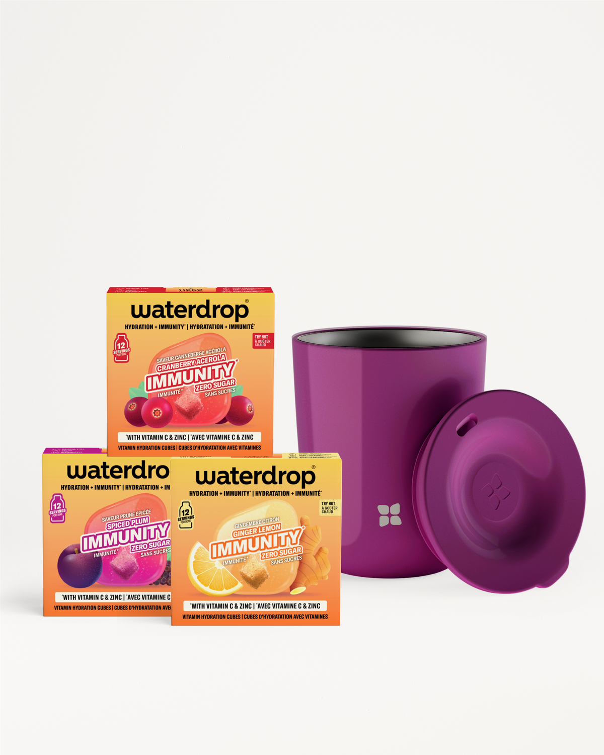 Tres cajas Immunity de Waterdrop con una taza aislante morada y tapa.
