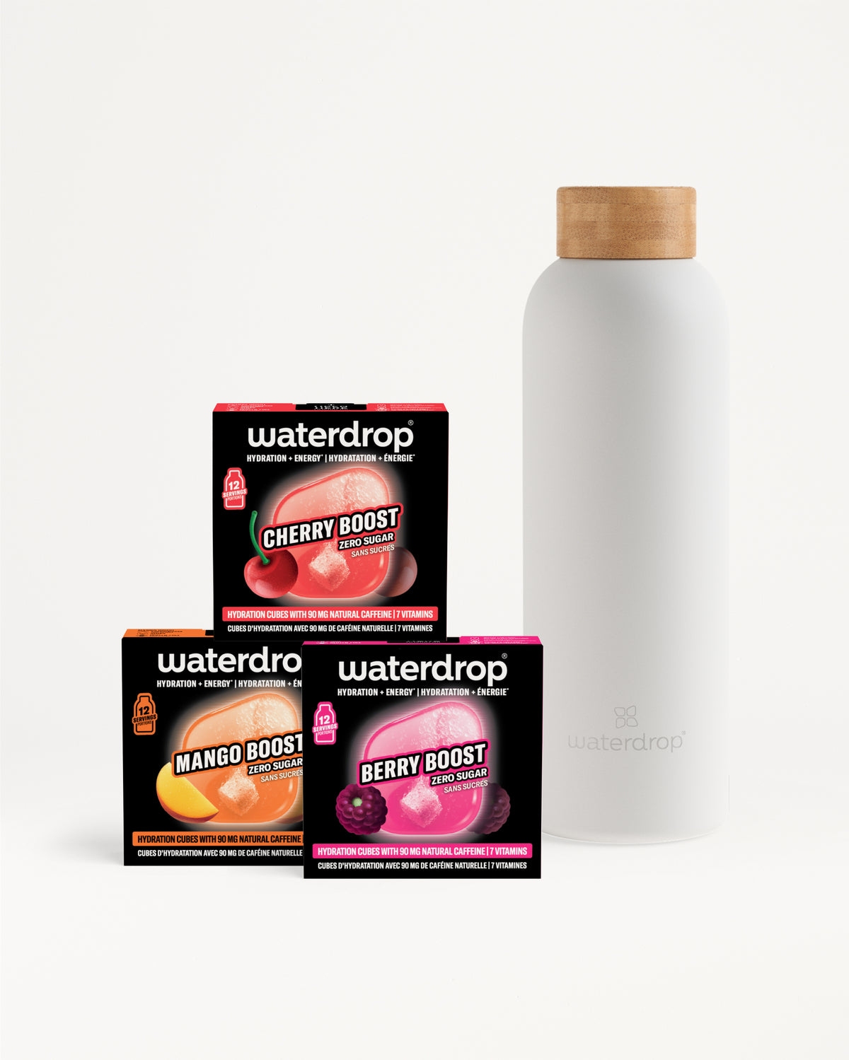 Tres cajas Waterdrop Flavor Boost (cereza, mango, baya) junto a una botella blanca con tapa de madera.